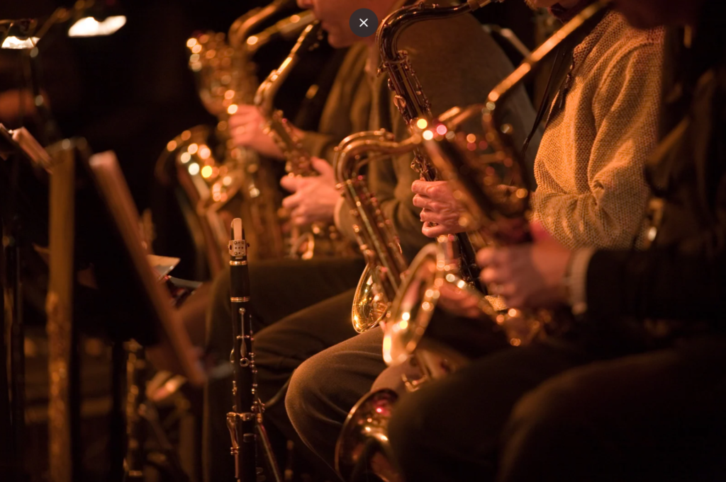 Saxophone section of a jazz band in a festival